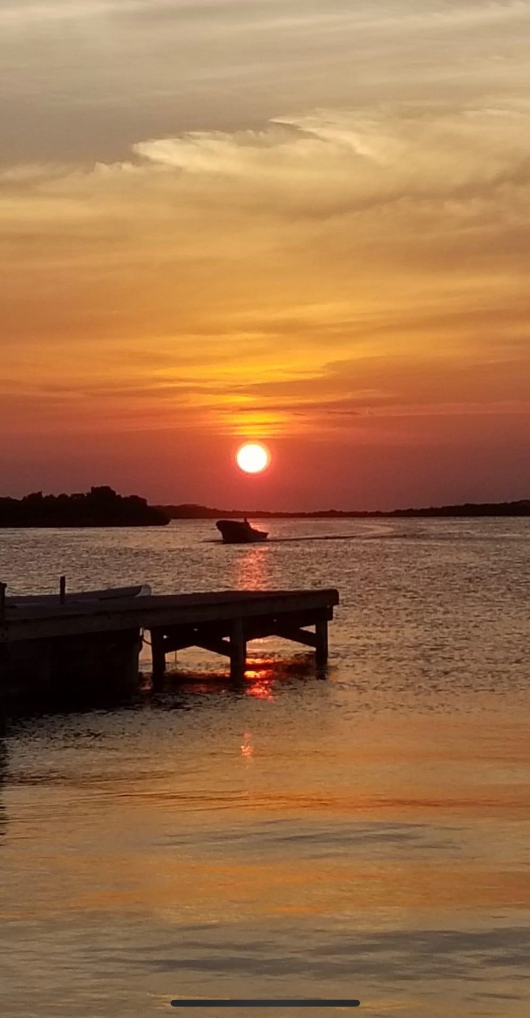 Sunset beside a quiet dock